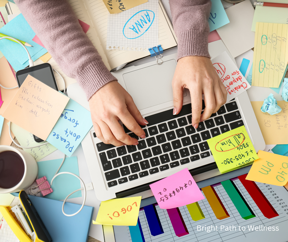 A digital person on the laptop, full of post-its and to-do lists around.