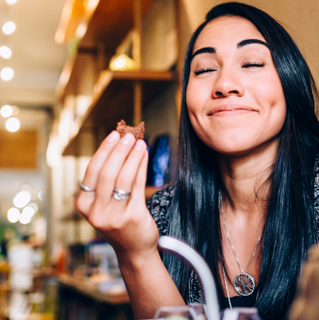 A woman practicing mindful eating to improve digestion and reduce emotional eating.